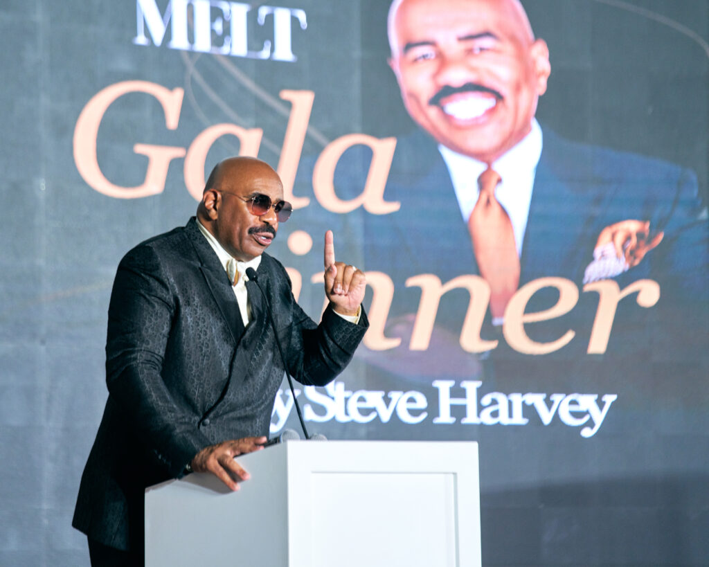 Steve Harvey smiles for the camera at the Melt Golf Classic