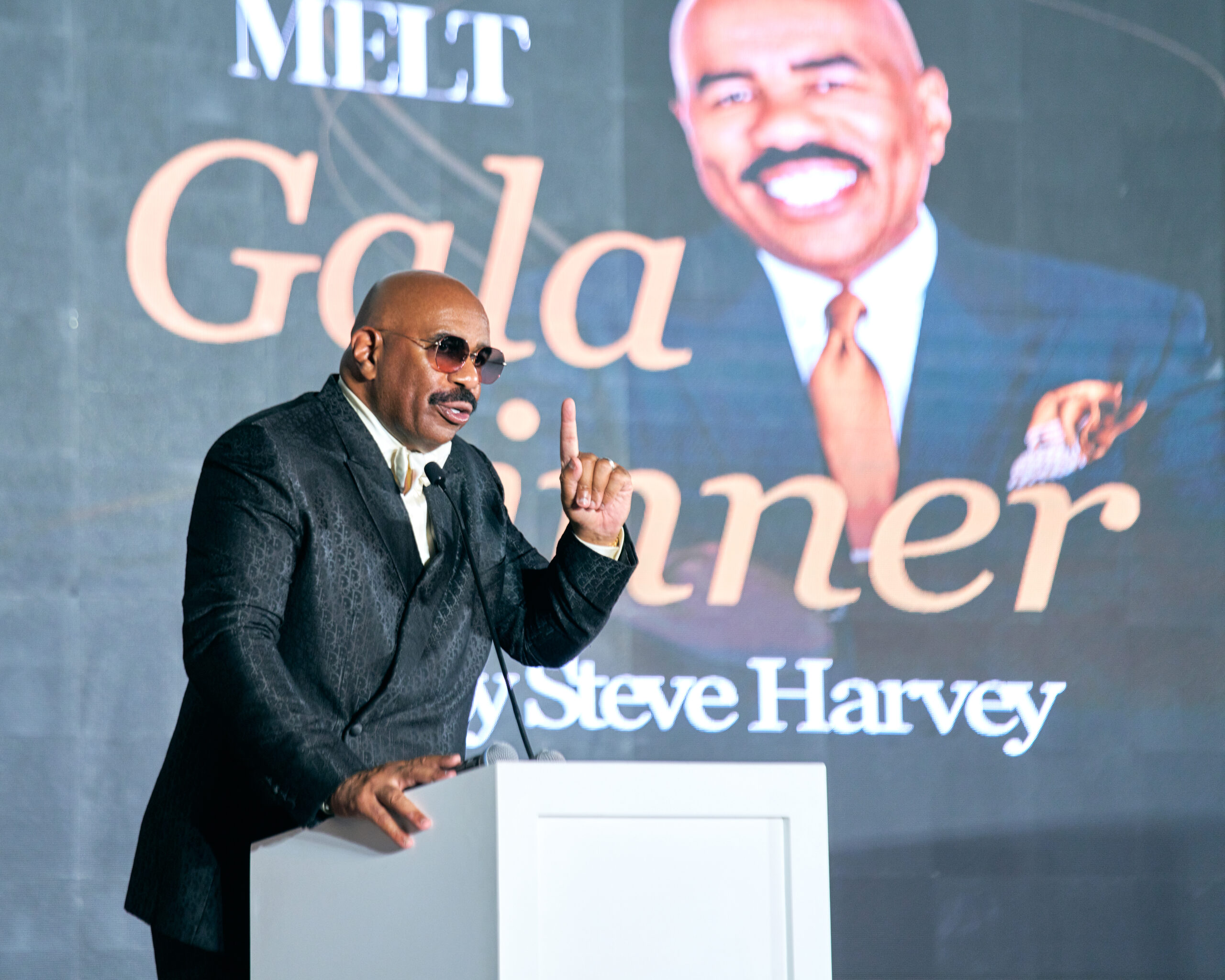 Steve Harvey smiles for the camera at the Melt Golf Classic
